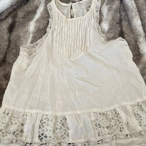 Hollister cream color tank top with lace detail. Very flattering on!